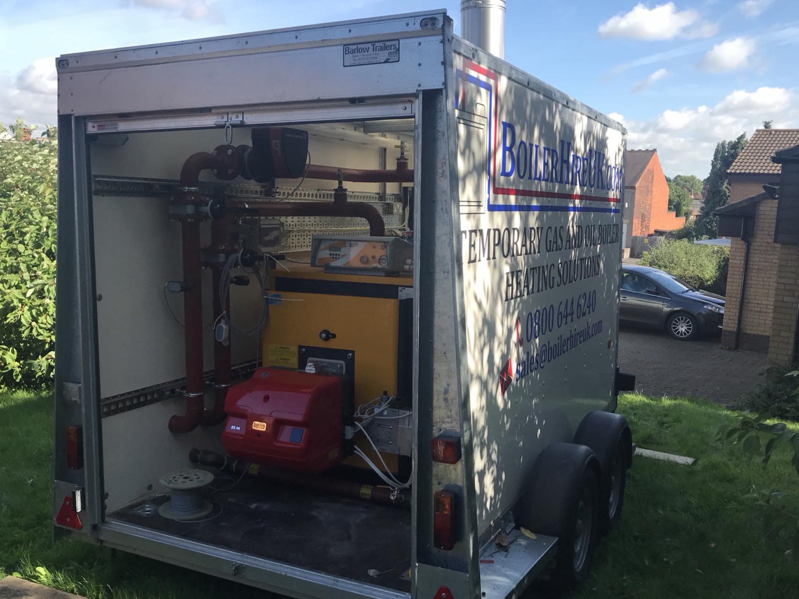 Burner, pipework and controls inside a trailer-mounted industrial hire boiler